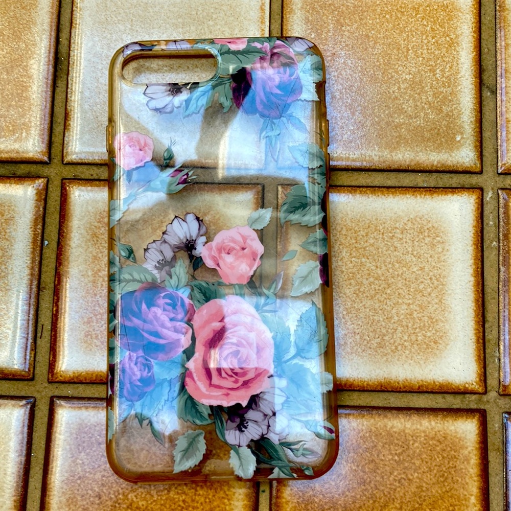 It’s a flowery pink and purple and green iPhone 11/12 phone case
